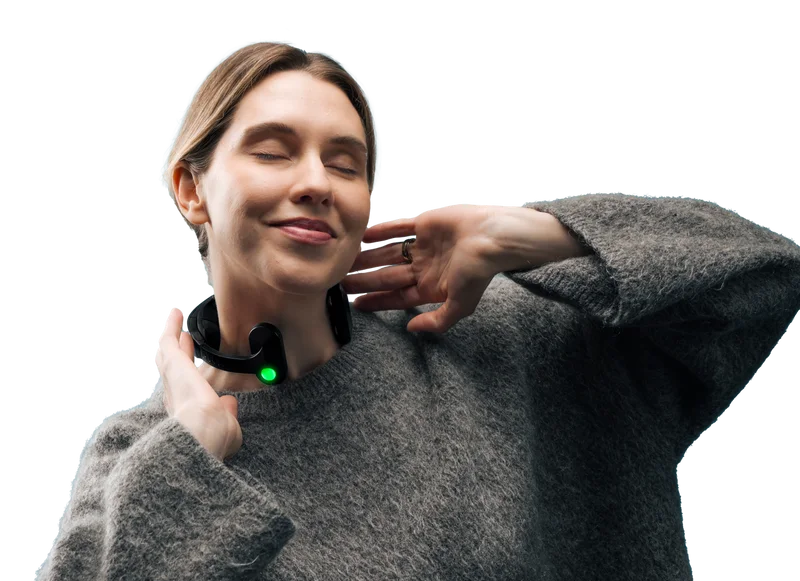 Woman relaxing while wearing the Pulsetto device